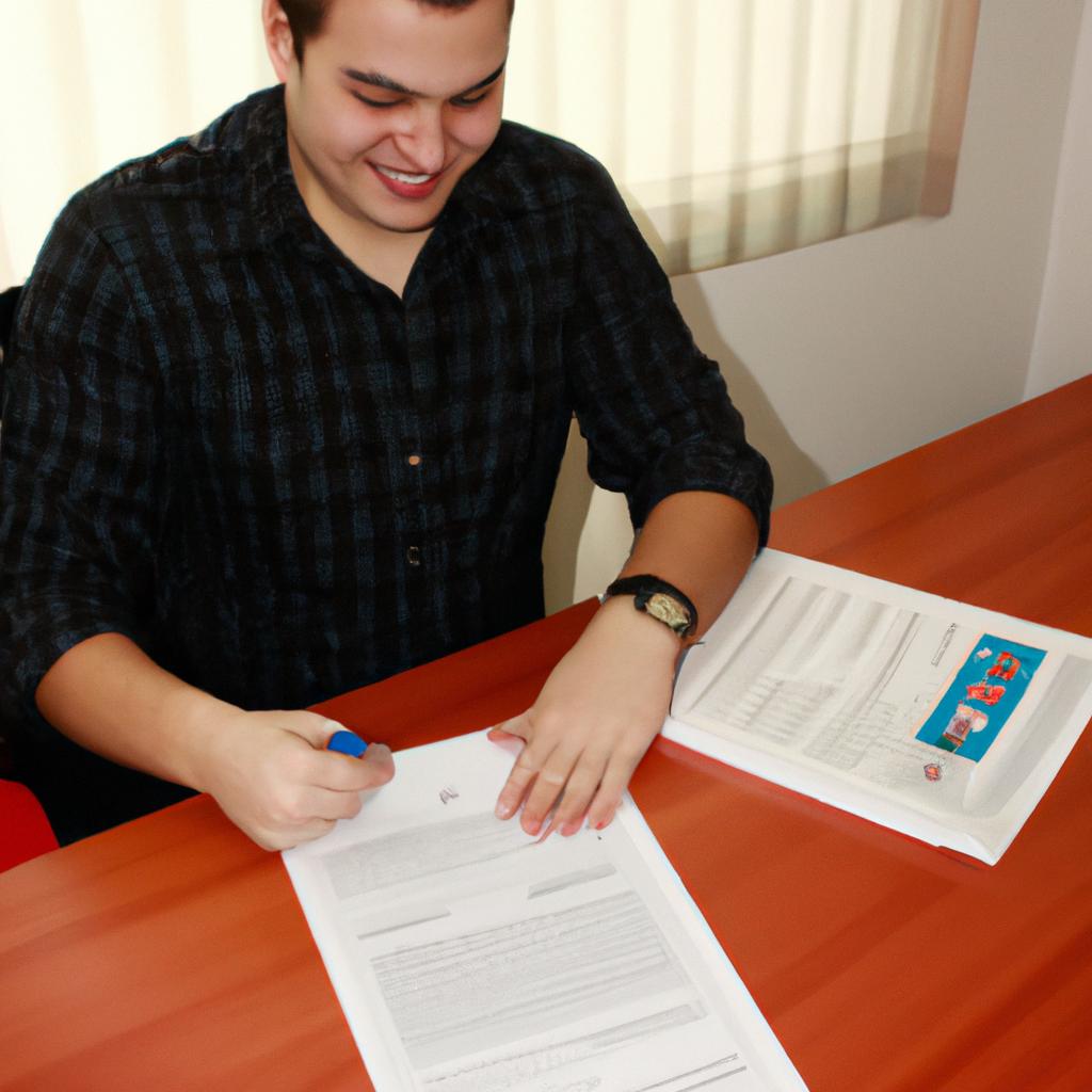 Person signing loan documents, smiling